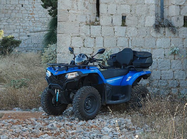 blue-atv-parked-in-front-of-fort-walls-in-hvar
